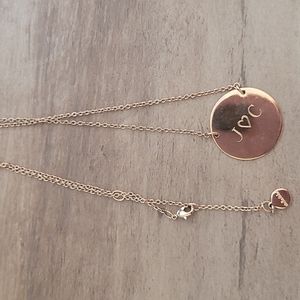 Engraved Stella and dot disc rosegold tone necklace.
